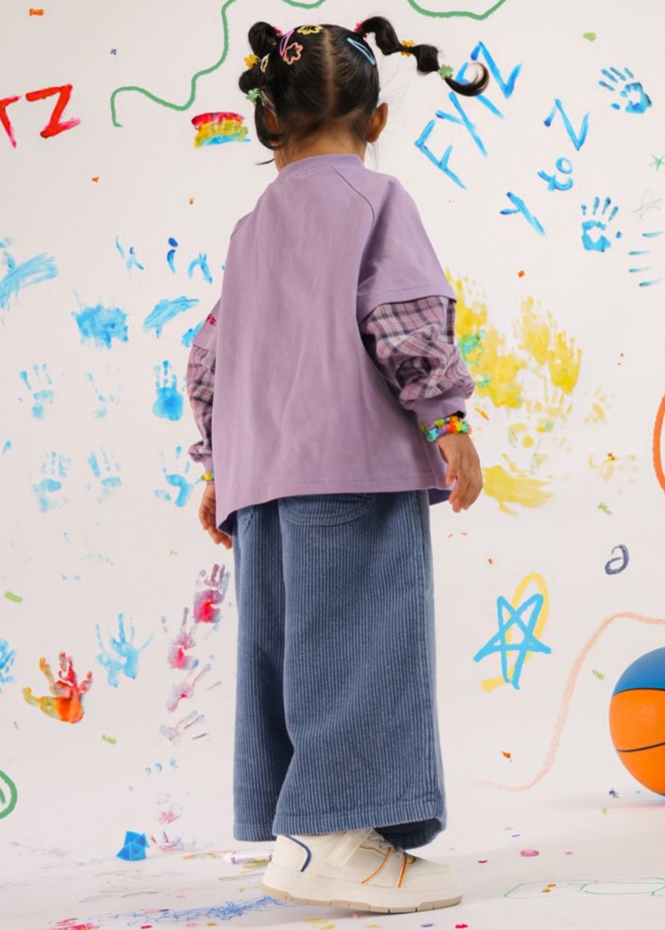 Child modelling unique kids top Ollie double-sleeve in purple fig — From Y To Z kidswear NZ