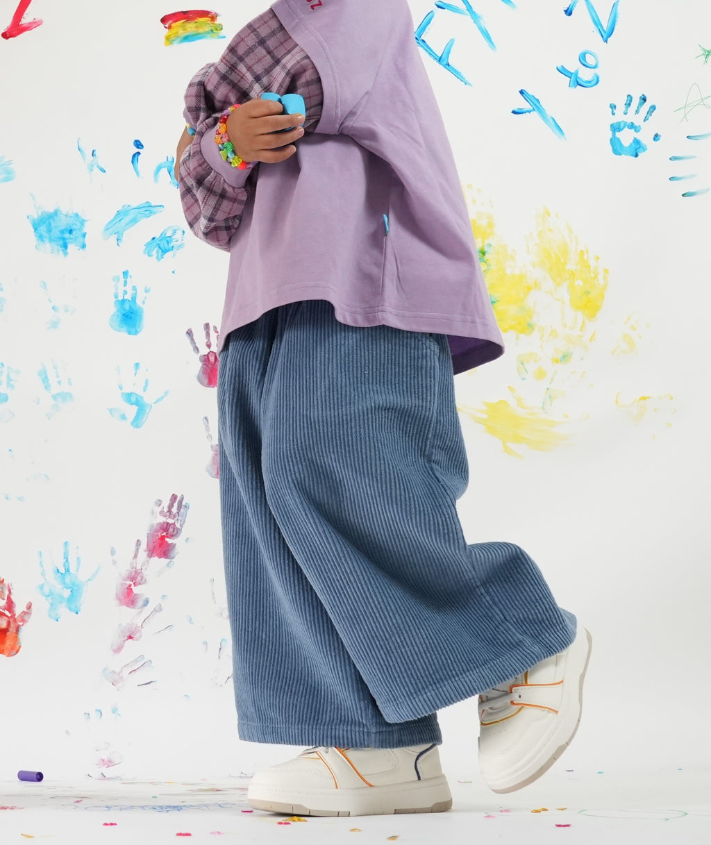 Child wearing Blaze blue cord pants with elastic waistband and Ollie double-sleeve in purple fig — From Y To Z