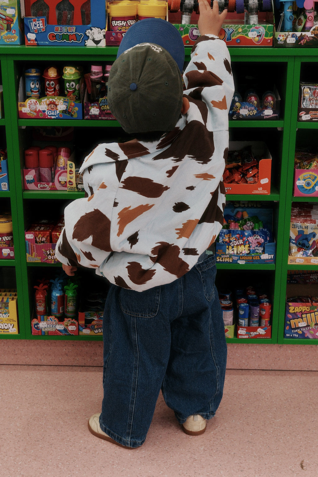 Toddler in convenience store wearing ruhi denim jean in true blue
